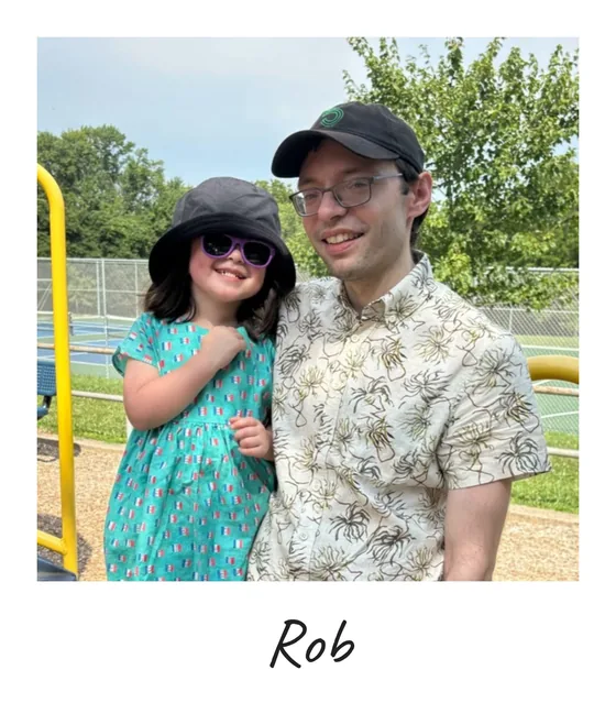 Polaroid of Rob Mackenzie with a young girl