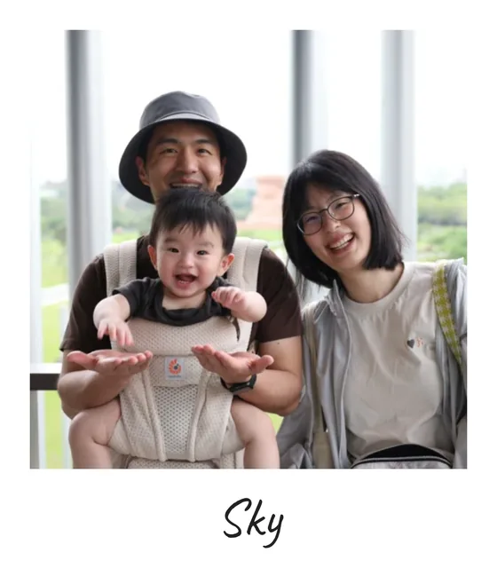 Polaroid of Sky Lan with a baby and family
